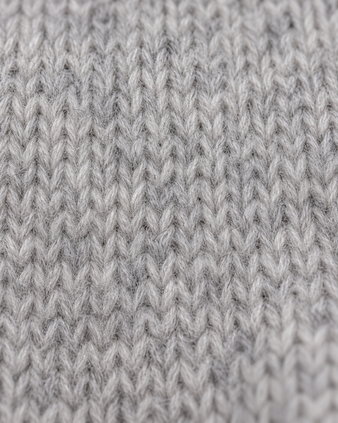 Brushed light heather grey knit texture of the Crewneck Sweater Soft Heritage