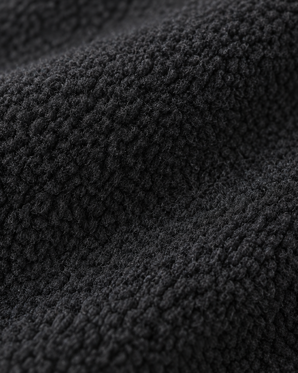 Charcoal-black short-pile fleece texture of the Fleece Jacket Alpine Refined