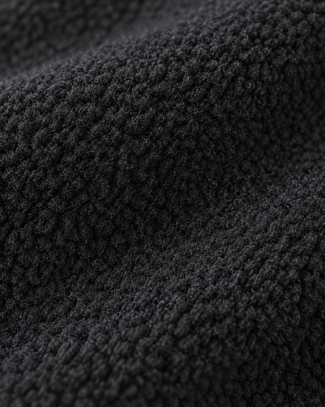Charcoal-black short-pile fleece texture of the Fleece Jacket Alpine Refined
