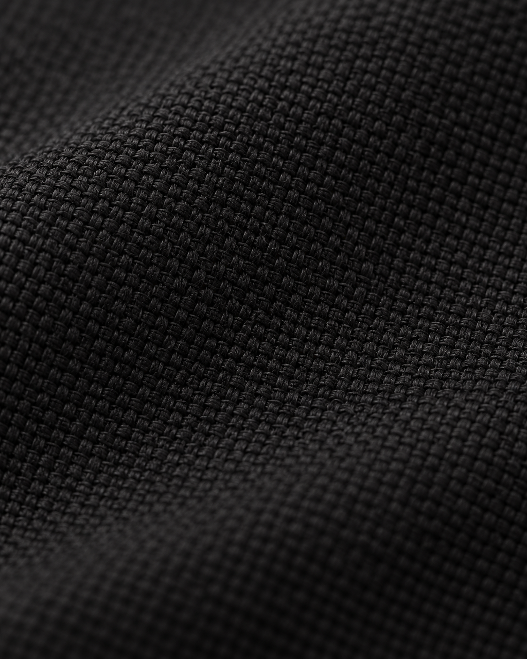 Matte black woven fabric texture of the Hooded Jacket Urban Shelter