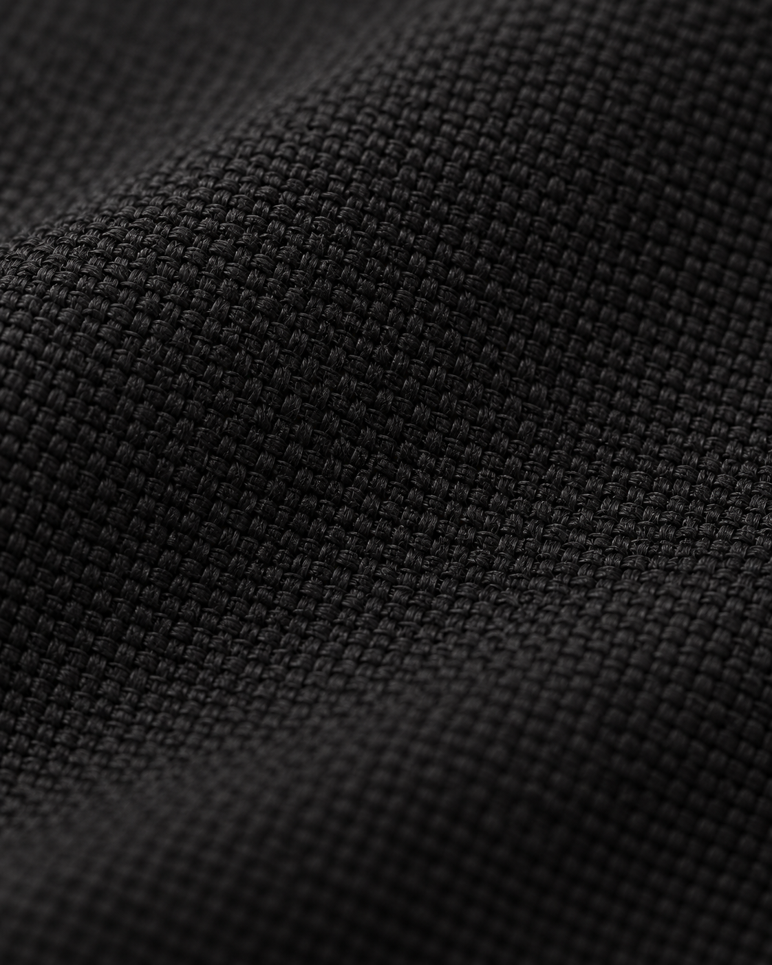 Matte black woven fabric texture of the Hooded Jacket Urban Shelter